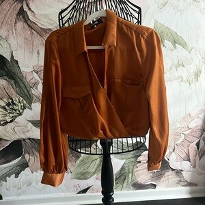 Orange Do+ Be wrap top.
